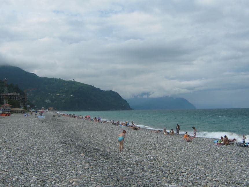 The pebble beach at Gonio with mountains on the horizon